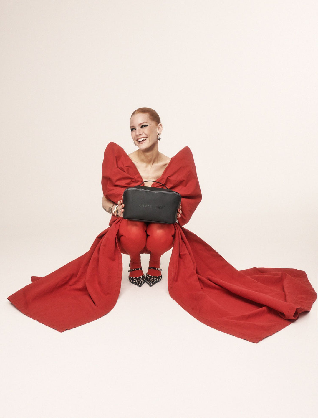 Linda Hallberg holding the Holiday calendar 2025